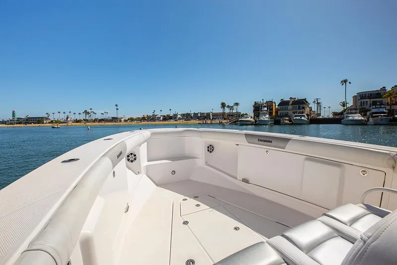 Slide: The Image of 2013 Everglades 355 Center Console boat on calm water, coastal view. - 4