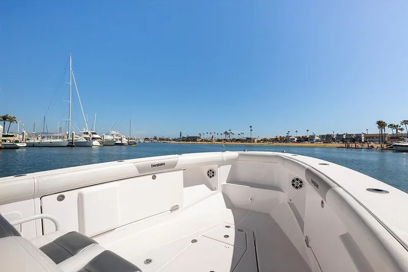 Slide: The Image of 2013 Everglades 355 Center Console boat docked in a sunny marina. - 5