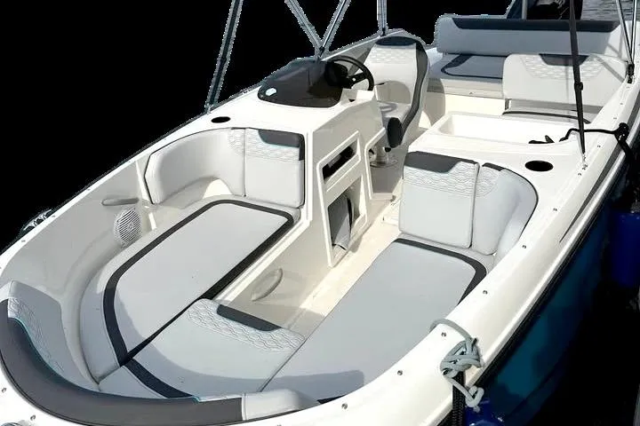 Slide: The Image of 2024 Bayliner Element M19 boat interior with modern seating and steering console. - 15