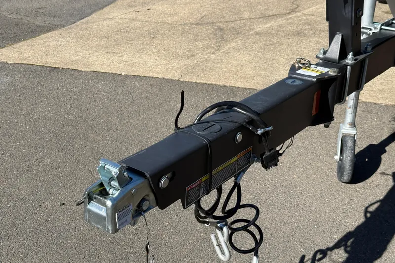 Slide: The Image of Trailer hitch of 2024 Bayliner Element M19 boat on pavement. - 16