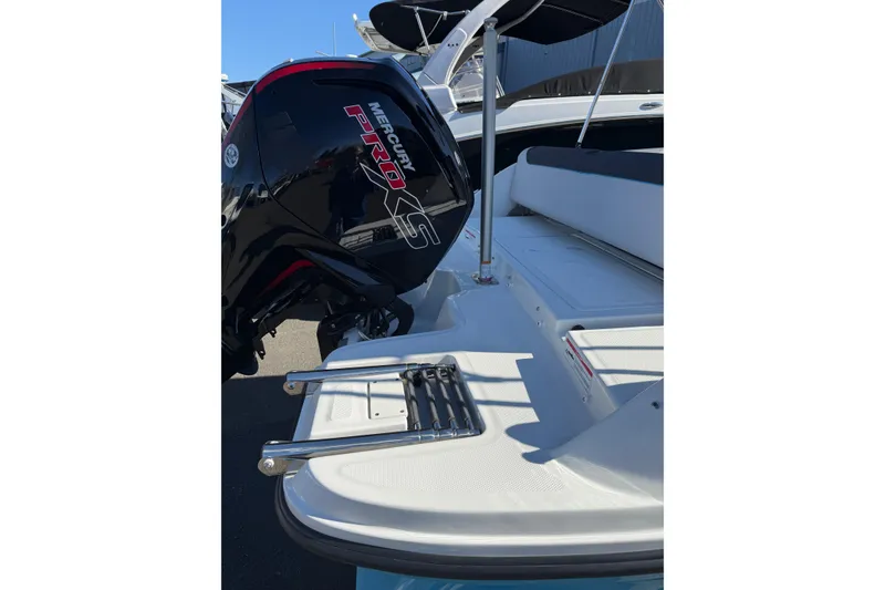 Slide: The Image of 2024 Bayliner Element M19 boat with Mercury Pro XS engine, rear view. - 5