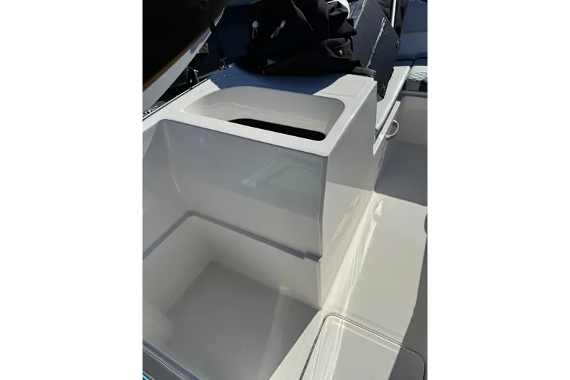 Slide: The Image of 2024 Bayliner Element M19 boat interior with seating and storage compartments. - 9