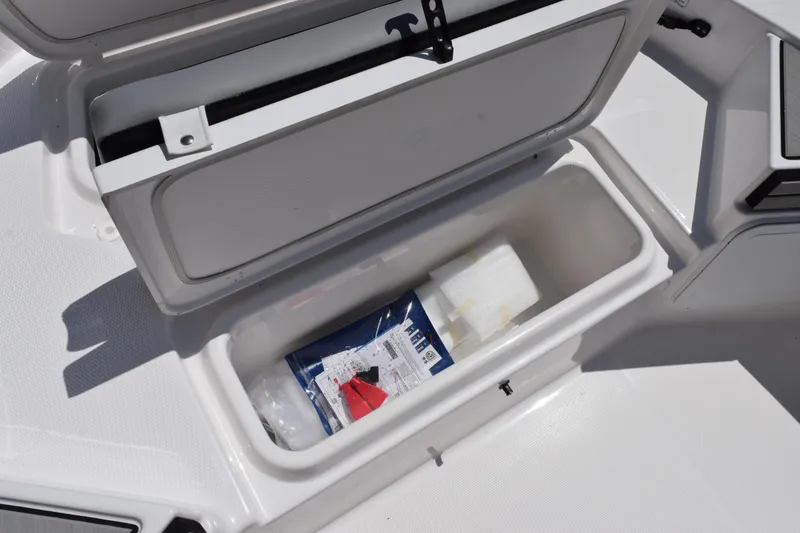 Slide: The Image of Storage compartment on 2026 Yamaha Boats 190 FSH Sport, featuring organized interior space. - 14