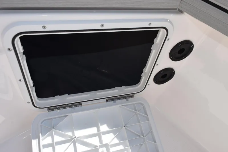 Slide: The Image of Open storage compartment on 2026 Yamaha Boats 190 FSH Sport. - 15