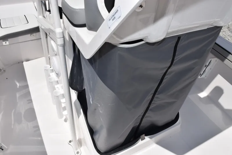 Slide: The Image of 2026 Yamaha Boats 190 FSH Sport interior detail, featuring storage compartment and seating area. - 17