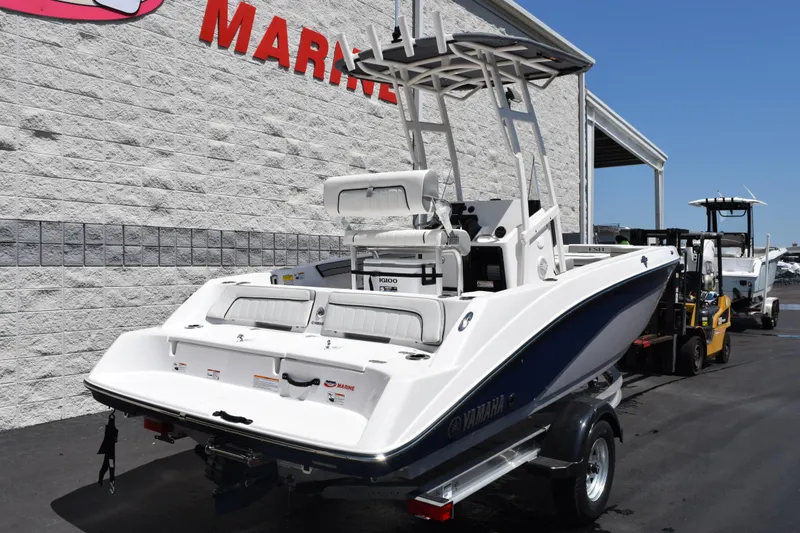 Slide: The Image of 2026 Yamaha Boats 190 FSH Sport on trailer, displayed outside marine dealership. - 4