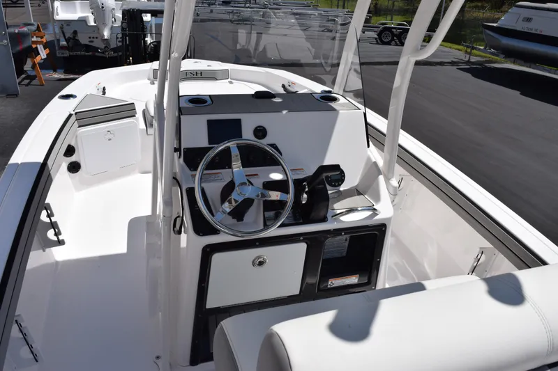 Slide: The Image of 2026 Yamaha Boats 190 FSH Sport dashboard with steering wheel and controls. - 7