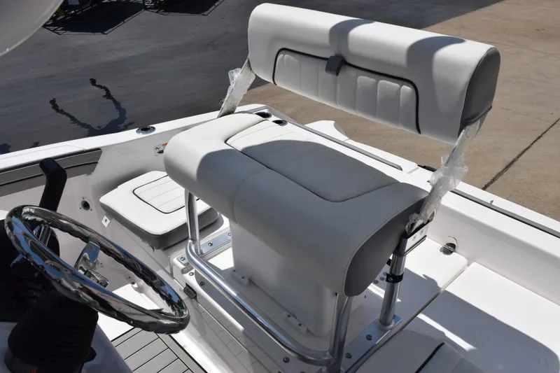 Slide: The Image of 2026 Yamaha Boats 190 FSH Sport interior with sleek seating and steering wheel. - 9