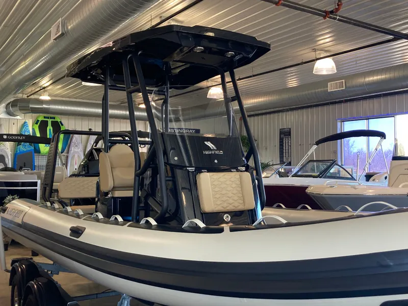 Slide: The Image of 2026 Highfield Sport 660 inflatable boat in a showroom. - 1
