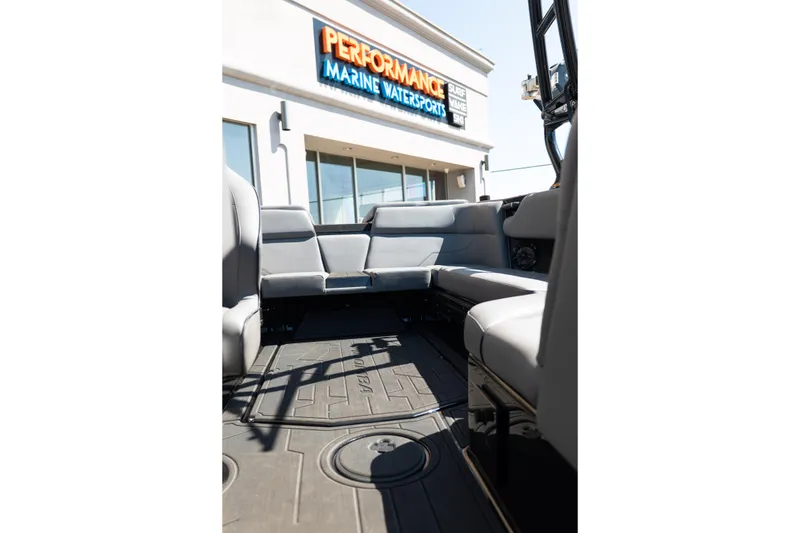 Slide: The Image of Interior of 2025 Moomba Max boat with gray seating at Performance Marine Watersports. - 10