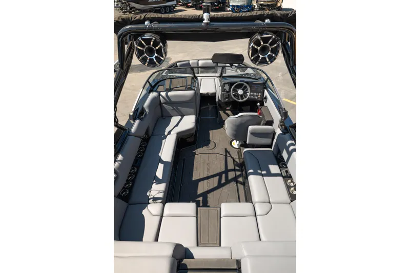 Slide: The Image of 2025 Moomba Max boat interior with spacious seating and modern dashboard design. - 17
