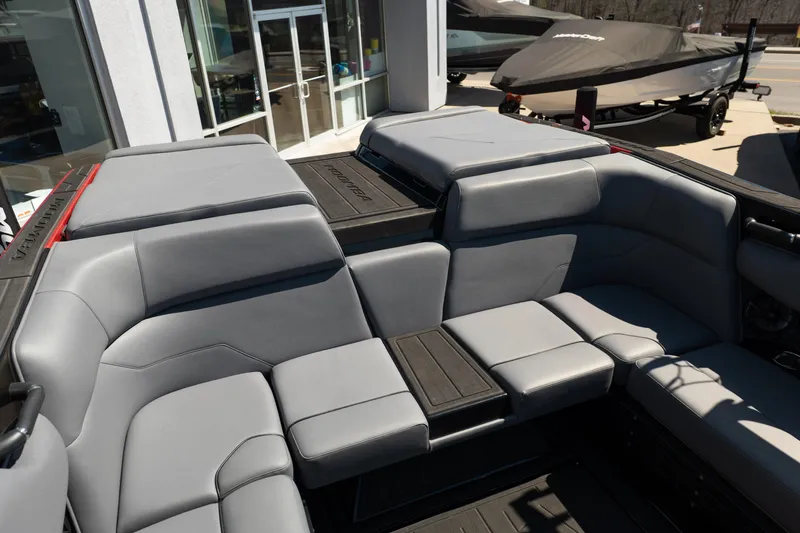 Slide: The Image of 2025 Moomba Max boat interior with gray seating and sleek design. - 7