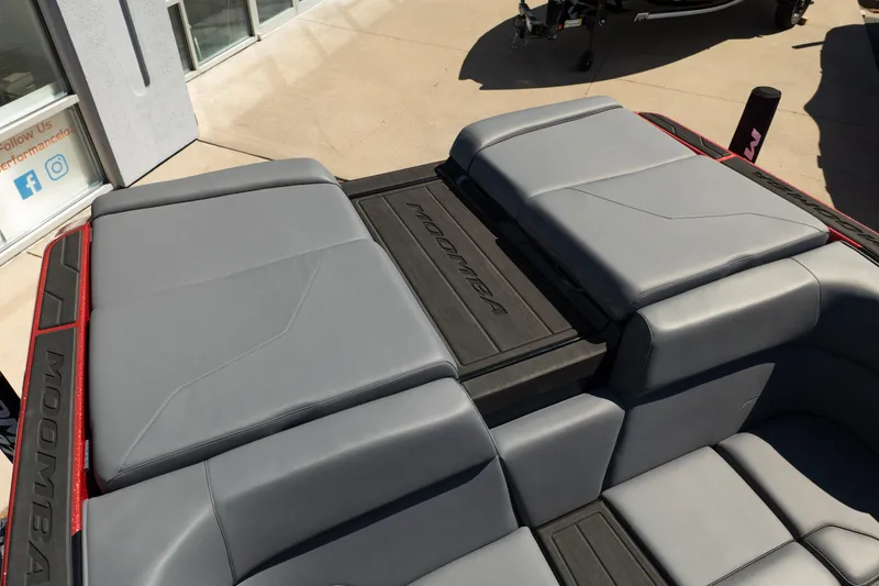 Slide: The Image of 2025 Moomba Max boat interior with sleek gray seating and modern design. - 8