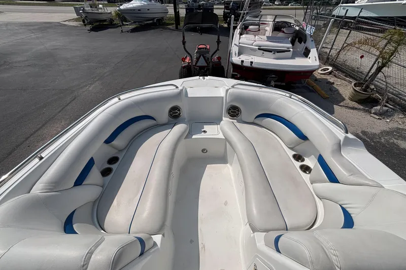 Slide: The Image of 2013 Hurricane SunDeck 2200 DC OB boat interior with white and blue seating. - 16