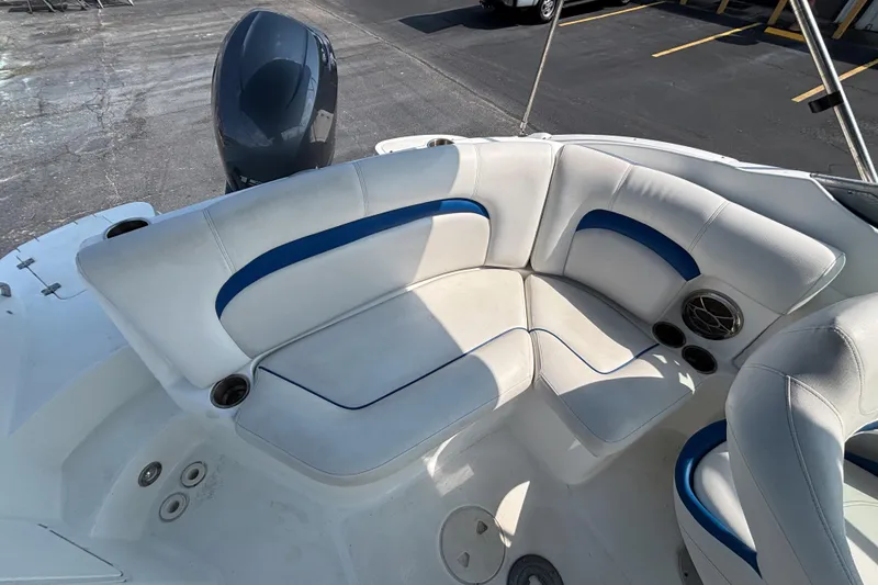 Slide: The Image of 2013 Hurricane SunDeck 2200 DC OB boat interior with white and blue seating. - 17