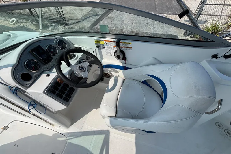 Slide: The Image of 2013 Hurricane SunDeck 2200 DC OB boat cockpit with steering wheel and gauges. - 19