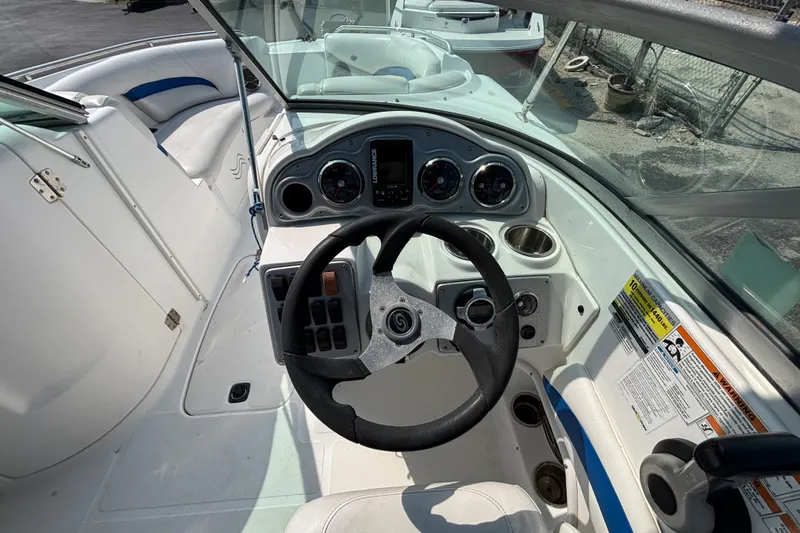 Slide: The Image of 2013 Hurricane SunDeck 2200 DC OB boat cockpit with steering wheel and gauges. - 20