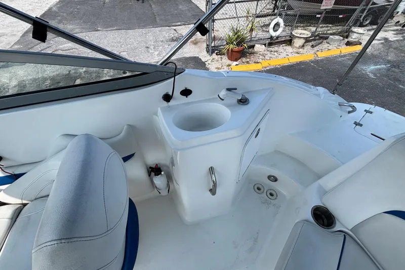 Slide: The Image of 2013 Hurricane SunDeck 2200 DC OB boat interior with seating and sink area. - 22