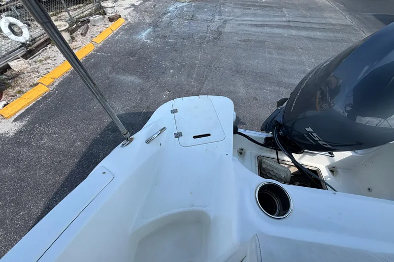 Slide: The Image of 2013 Hurricane SunDeck 2200 DC OB boat with outboard motor and deck details. - 25