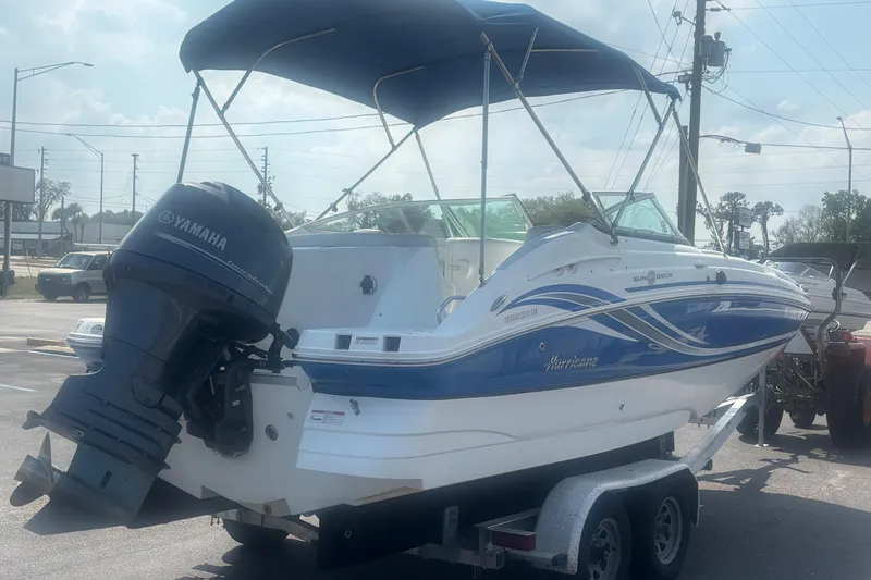 Slide: The Image of 2013 Hurricane SunDeck 2200 DC OB boat with Yamaha outboard motor on trailer. - 4