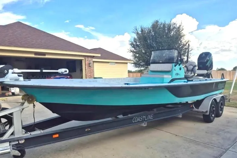 The Image of 2018 Haynie 25' Magnum boat on trailer in driveway. - 0