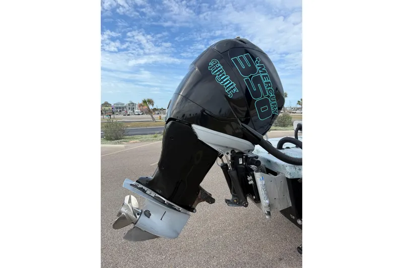 Slide: The Image of Outboard motor of a 2018 Haynie 25' Magnum boat, featuring a Mercury 350 engine. - 11