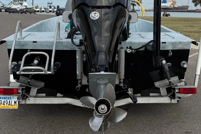 Slide: The Image of 2018 Haynie 25' Magnum boat rear view with motor and Kansas license plate. - 13