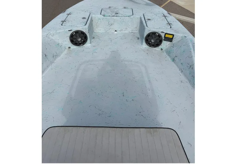 Slide: The Image of 2018 Haynie 25' Magnum boat deck with speakers and storage compartments. - 22