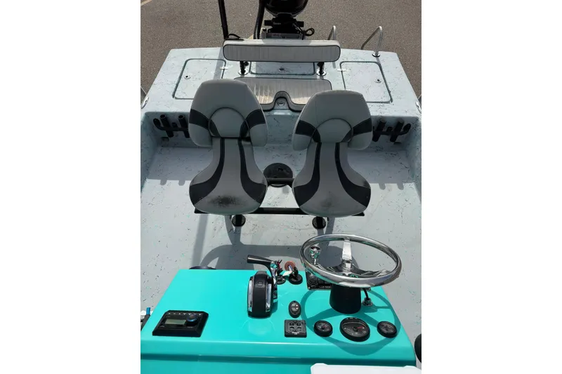 Slide: The Image of 2018 Haynie 25' Magnum boat interior with dual seats and steering console. - 24