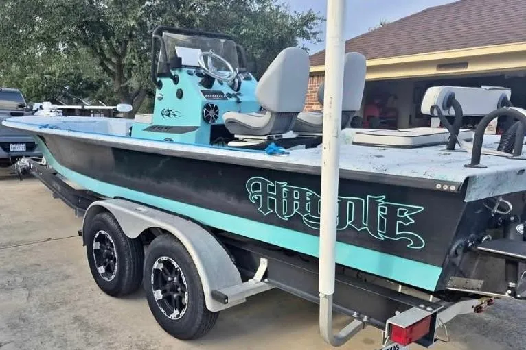 Slide: The Image of 2018 Haynie 25' Magnum boat on trailer, featuring sleek design and dual seating. - 6