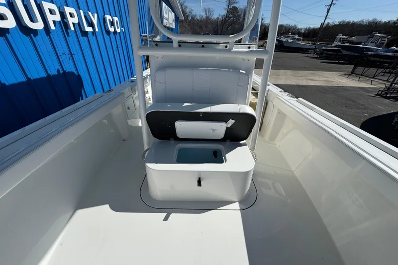 Slide: The Image of 2026 Parker 230 Coastal Elite boat interior with open storage compartment. - 11