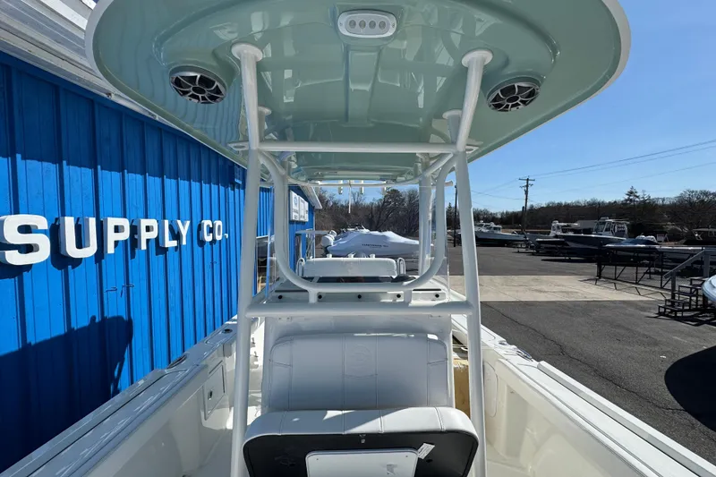 Slide: The Image of 2026 Parker 230 Coastal Elite boat at a supply company, showcasing sleek design and modern features. - 12
