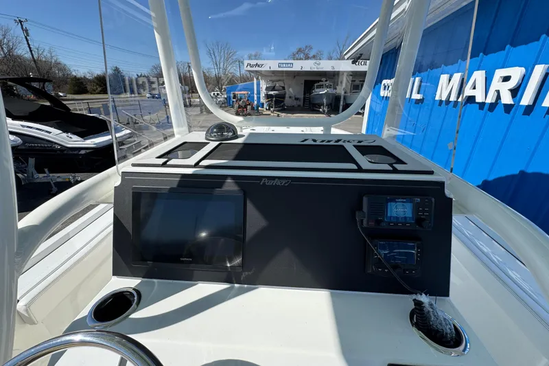 Slide: The Image of 2026 Parker 230 Coastal Elite boat dashboard with Garmin navigation system at marina. - 15