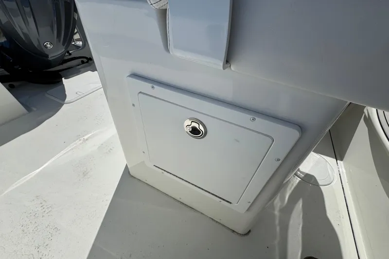 Slide: The Image of Storage compartment on a 2026 Parker 230 Coastal Elite boat deck. - 16