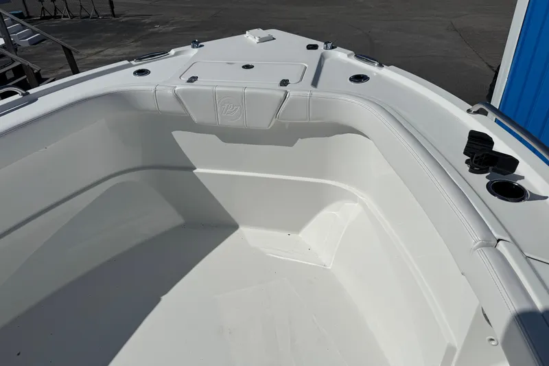 Slide: The Image of 2026 Parker 230 Coastal Elite boat interior, featuring sleek white seating and modern design elements. - 19