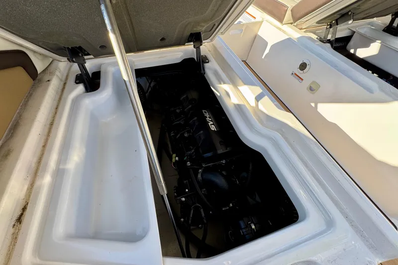 Slide: The Image of Open engine compartment of 2022 Yamaha Boats 275SD, showcasing internal components. - 18