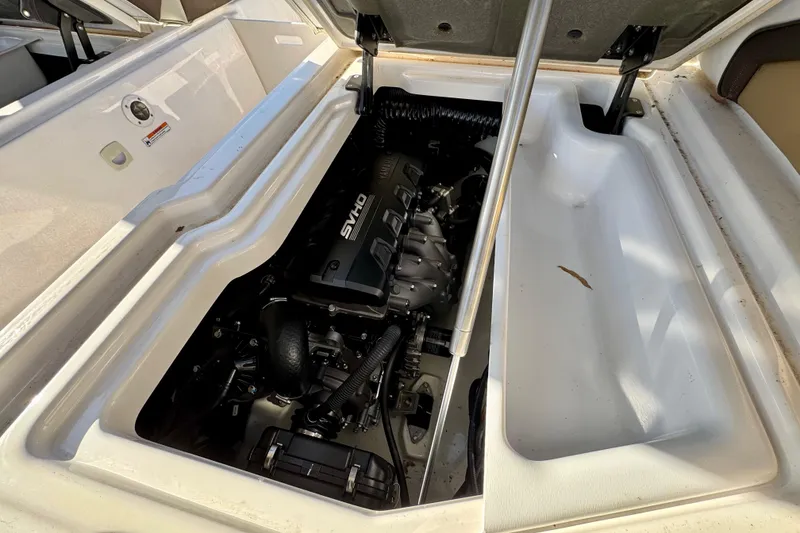 Slide: The Image of 2022 Yamaha Boats 275SD engine compartment showcasing powerful SVHO engine. - 19
