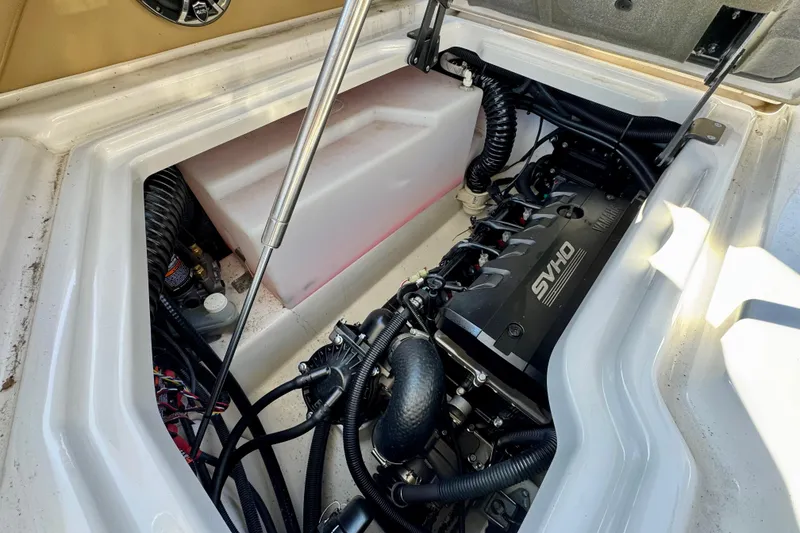 Slide: The Image of Engine compartment of 2022 Yamaha Boats 275SD, showcasing the powerful SVHO engine. - 21