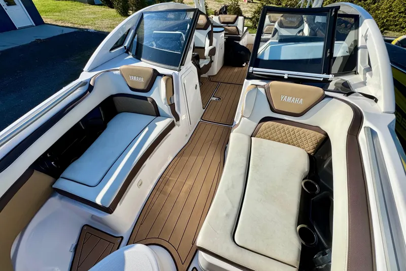 Slide: The Image of 2022 Yamaha Boats 275SD interior with luxurious seating and sleek design. - 29