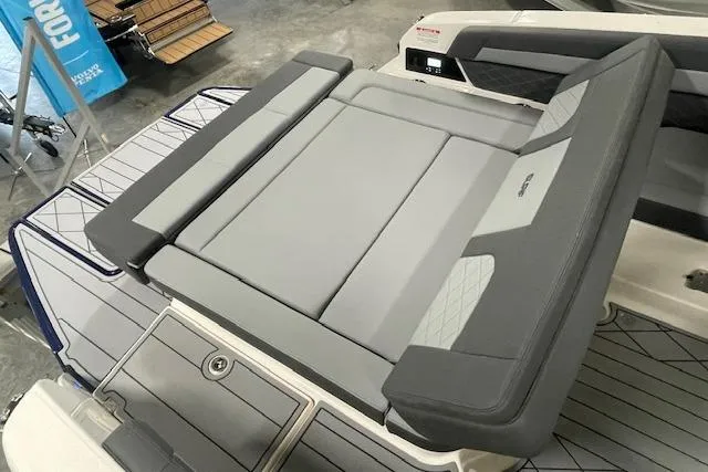 Slide: The Image of 2026 Chaparral SSX 6 boat interior with sleek gray seating and modern design. - 11
