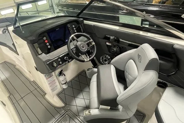 Slide: The Image of 2026 Chaparral SSX 6 boat interior with modern dashboard and comfortable seating. - 3