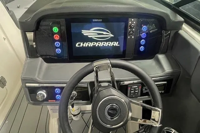 Slide: The Image of 2026 Chaparral SSX 6 boat dashboard with steering wheel and digital display. - 4