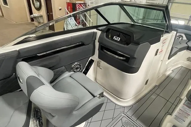 Slide: The Image of Interior view of 2026 Chaparral SSX 6 boat, featuring modern dashboard and seating. - 5