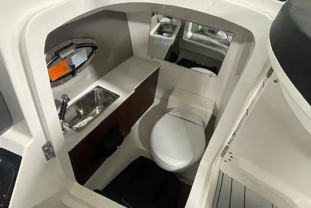 Slide: The Image of 2026 Chaparral SSX 6 boat interior with sink, toilet, and mirror. - 6