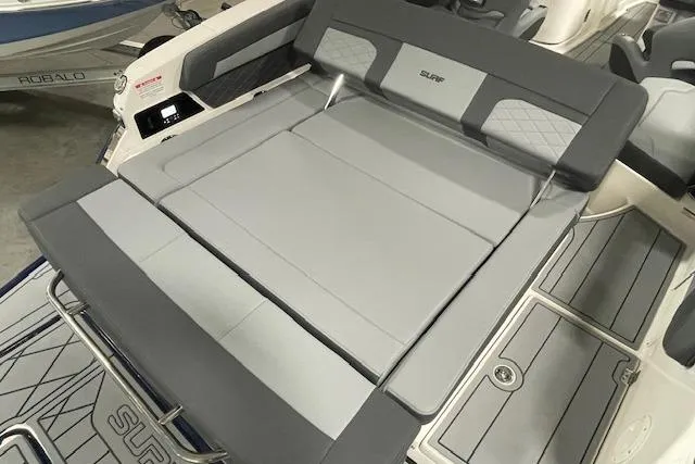 Slide: The Image of 2026 Chaparral SSX 6 boat interior with gray cushioned seating and sleek design. - 9