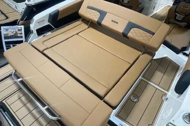 Slide: The Image of 2026 Chaparral SSX 6 boat interior with tan leather seating and sleek design. - 2