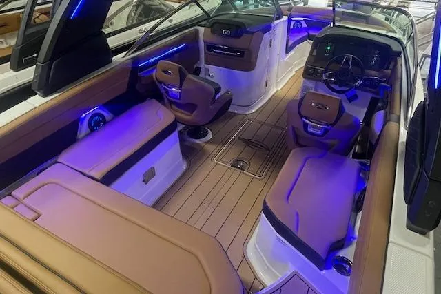 Slide: The Image of 2026 Chaparral SSX 6 boat interior with luxurious seating and ambient lighting. - 3