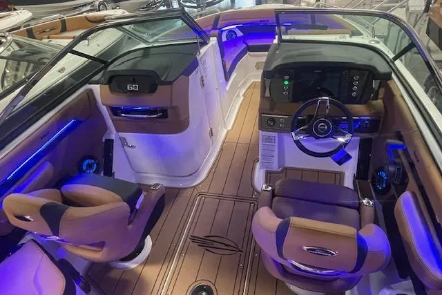 Slide: The Image of 2026 Chaparral SSX 6 boat interior with modern dashboard and luxurious seating. - 4