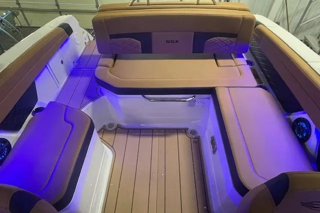 Slide: The Image of Luxurious interior of 2026 Chaparral SSX 6 boat with ambient lighting and plush seating. - 5