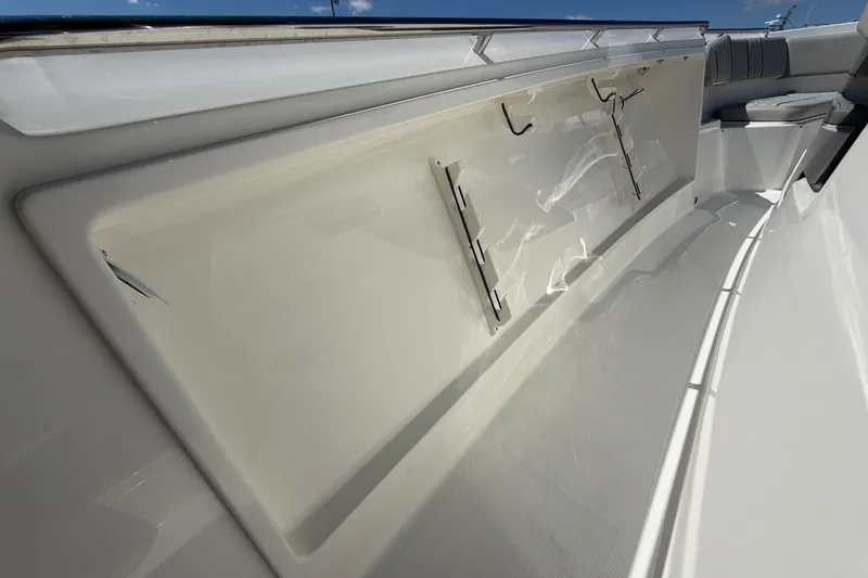 Slide: The Image of 2026 Pursuit S 358 Sport boat interior with sleek white deck and seating area. - 101